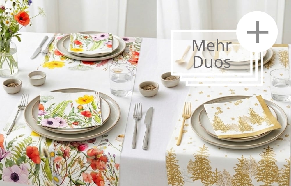 Passende Duos Servietten & Tischläufer: Gedeckter Tisch mit zwei Tischläufern und Servietten: links buntes Blumen-Design, rechts goldene Tannenbäume.