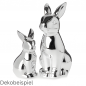 Zwei Porzellan Osterhasen in Silber.
