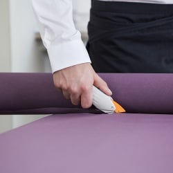 Elektrischer Duni Rollenschneider für Tischdecken, batteriebetrieben Elektrischer Duni Rollenschneider für Tischdecken, batteriebetrieben