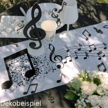 Dekobeispiel mit dem Vlies Tischläufer Noten, Musik in Weiß/Schwarz, 30 cm breit.