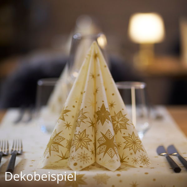 Gefaltete Duni Dunilin Servietten auf einem Tisch mit Tischläufer der SerieStargazing Cream mit goldenen Sternen.