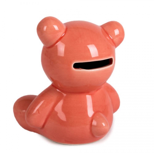Kleine Keramik Spardose in Form eines Teddybären in der Farbe apricot.